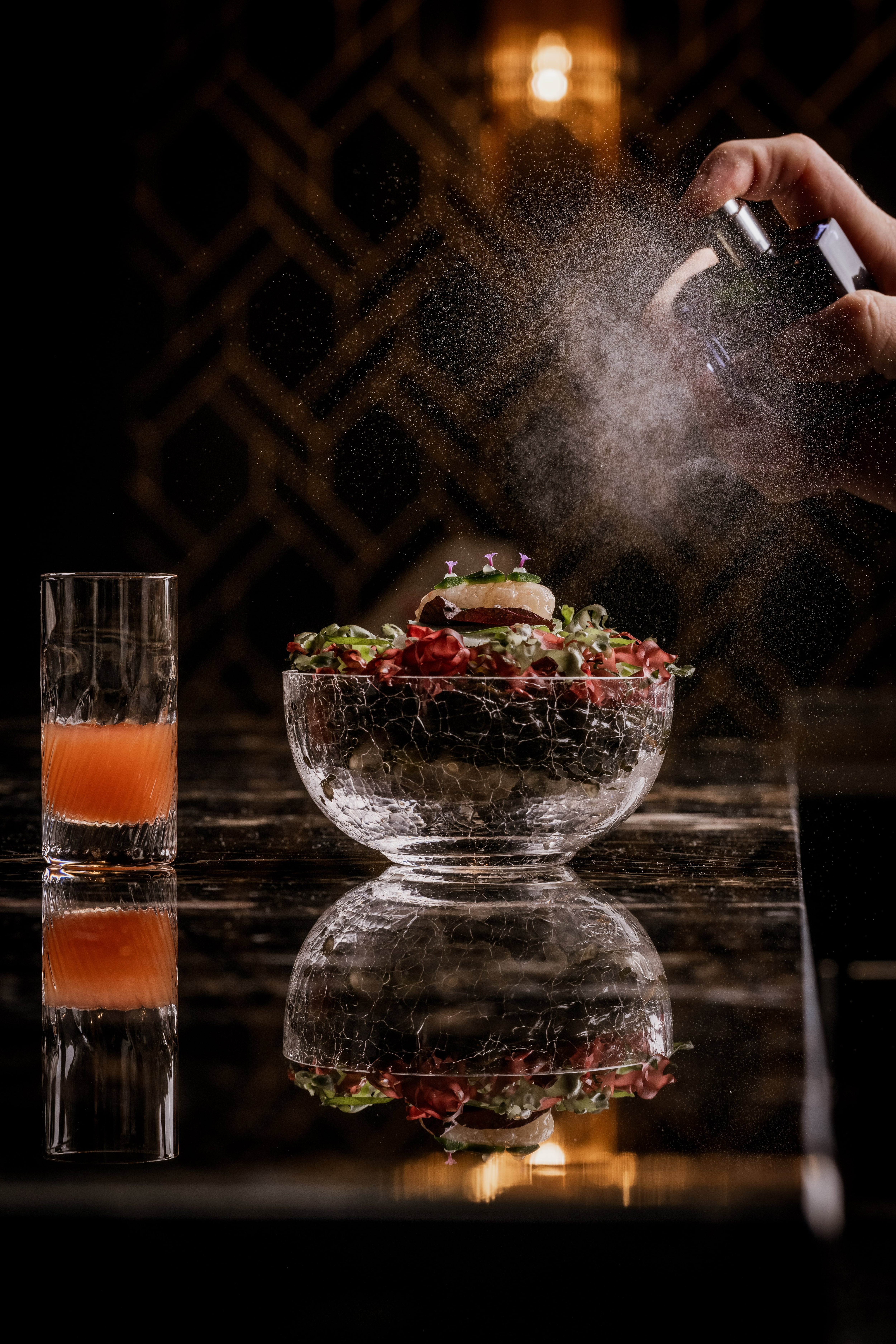 A dish being sprayed at BEAR by Carlo Scotto
