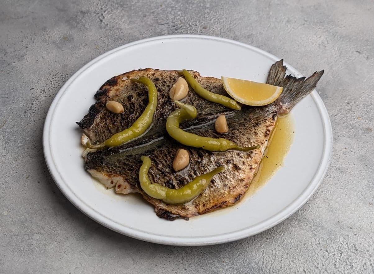 Jackson Boxer restaurant Dove food pic - Grilled Wild Sea Bream, Confit Garlic & Guindilla Peppers