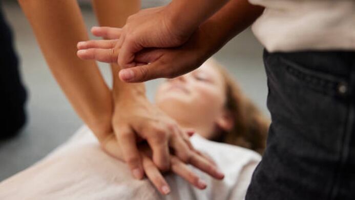 Someone giving CPR training
