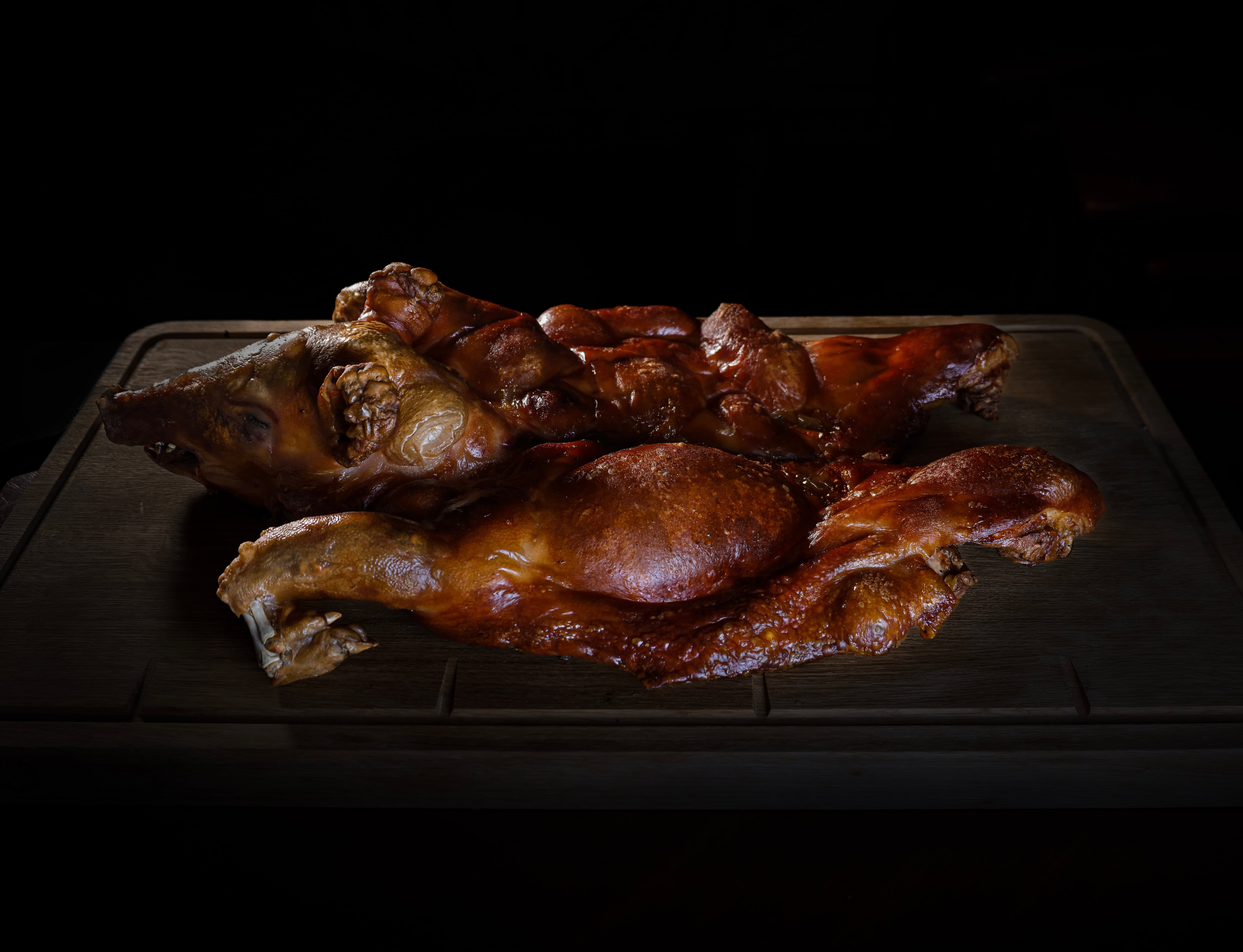 The menu at Lucky Cat Bishopsgate features a whole suckling pig to share between six