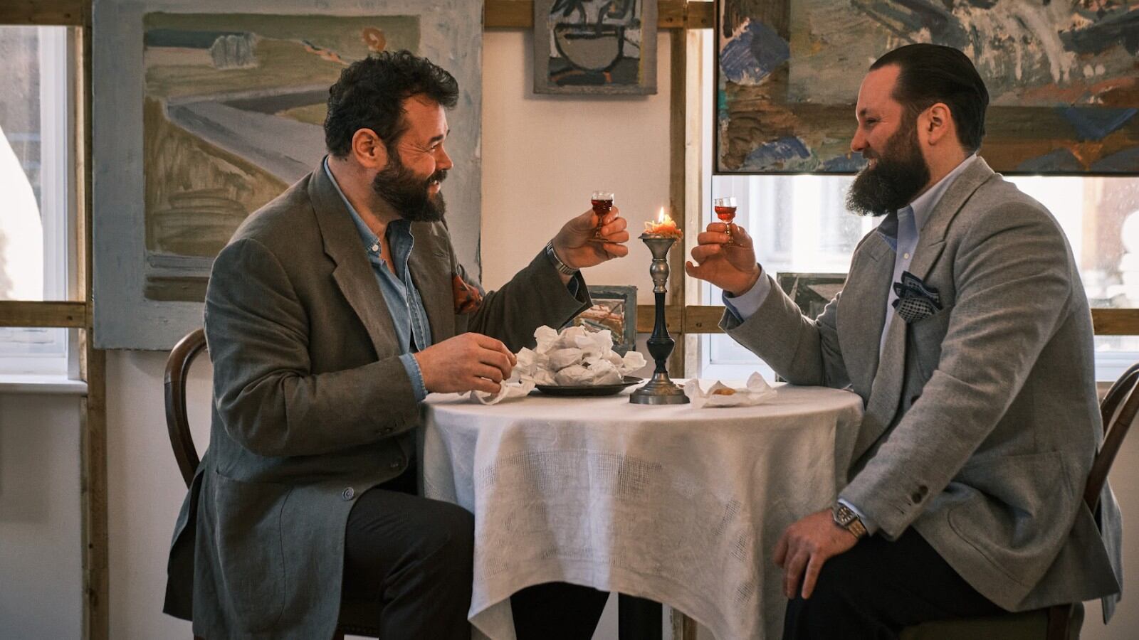 Charlie Mellor and Cameron Dewar sat at the table with drinks