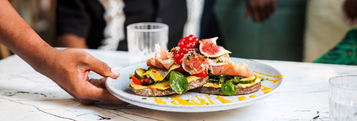 Plate of food being served in restaurant