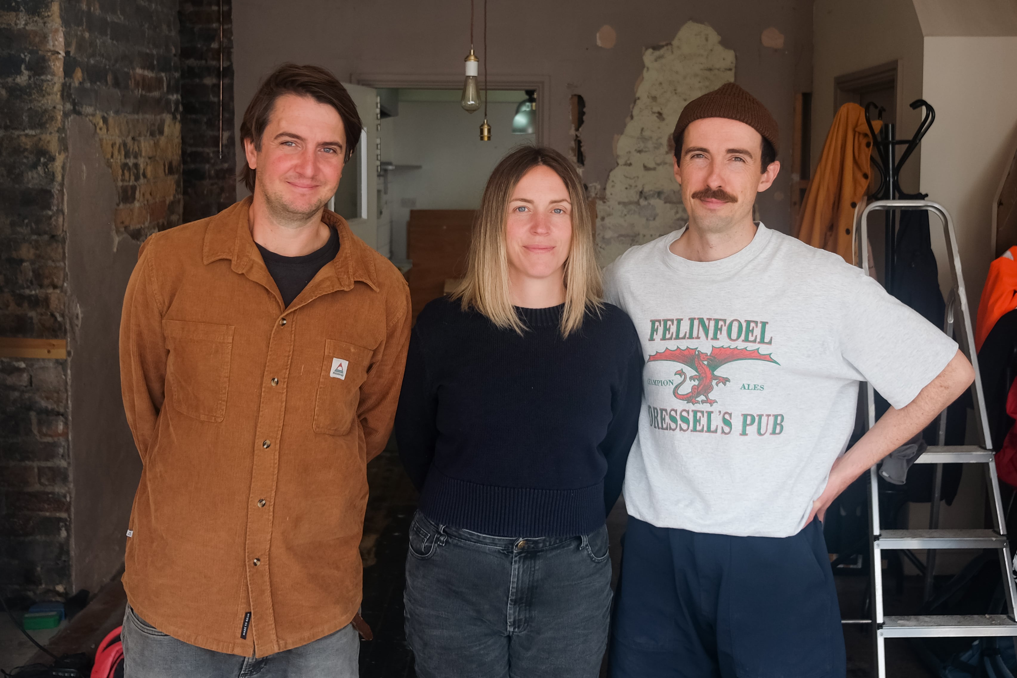 Alex Vines, Zanna Clarke and Siôn Iorwerth inside the space that will become Ogof