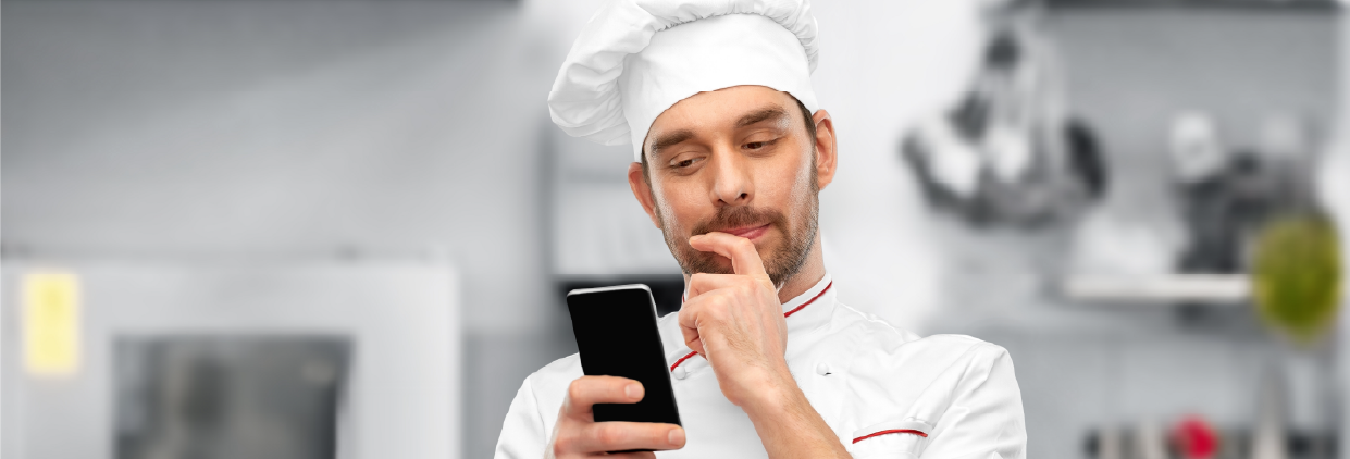 Chef looking at a phone