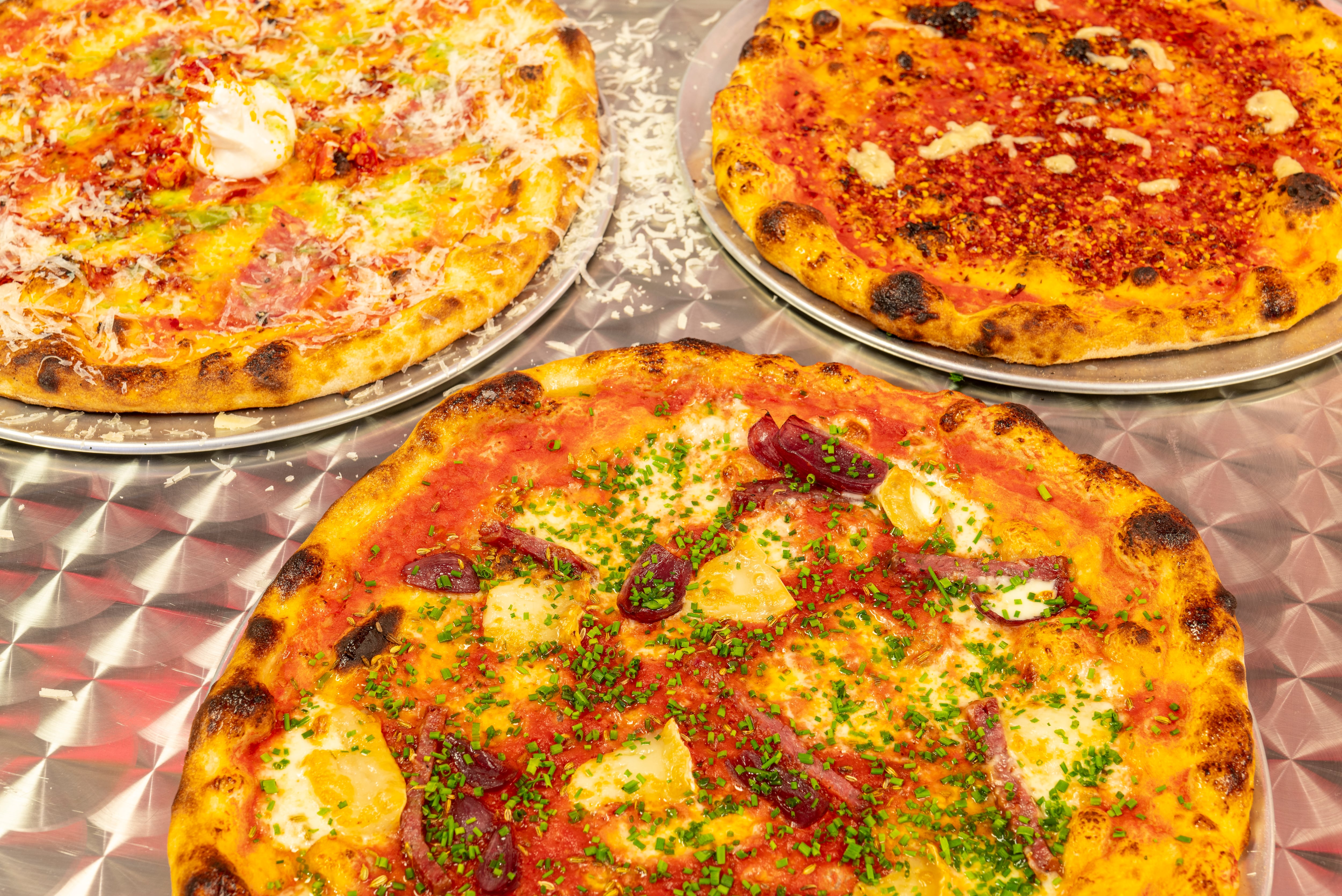 Three pizzas from Super Club Roma