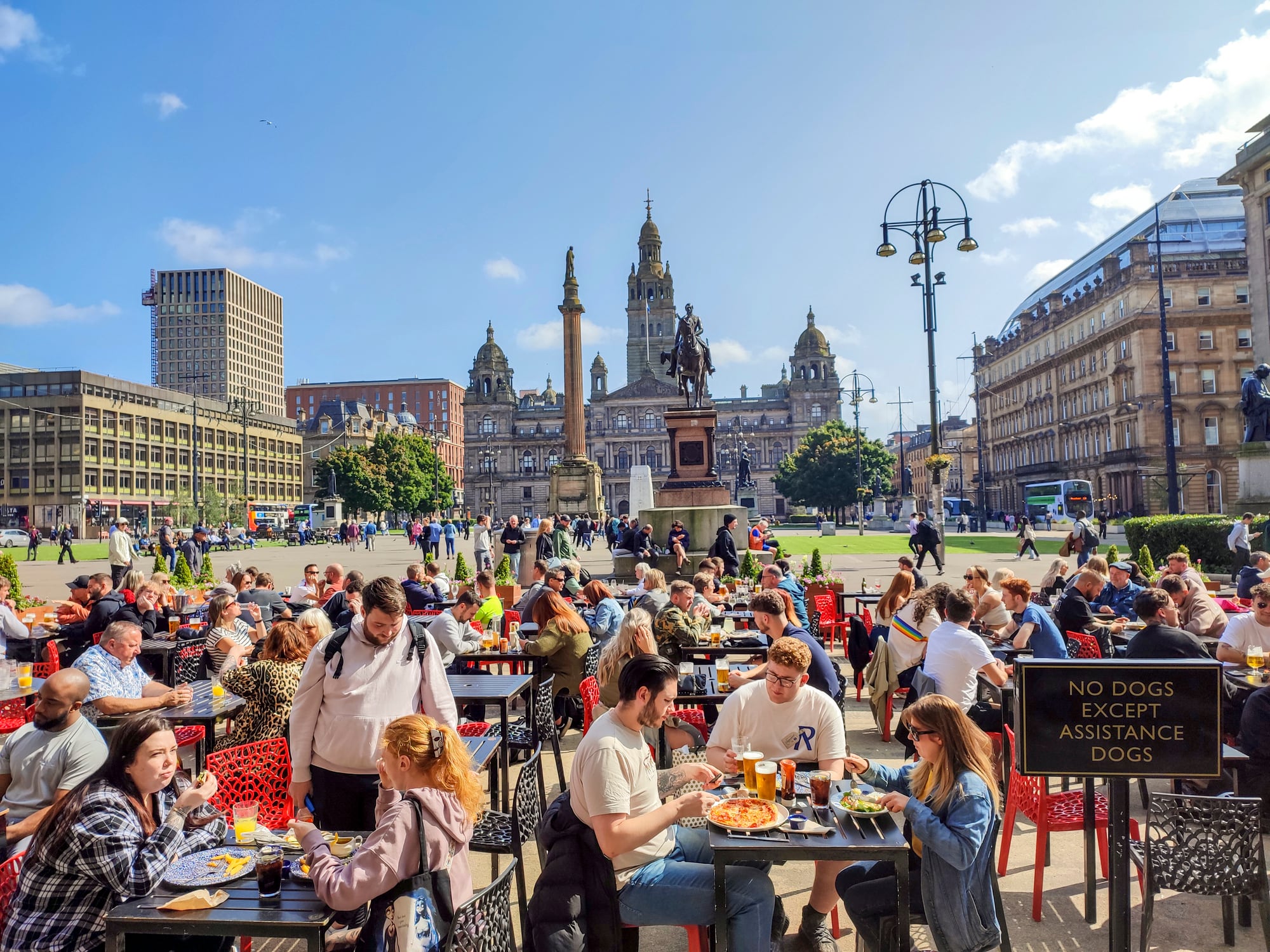Glasgow,  England UK - August 30, 2024: 
People having fun at open air restaurant of  george square  of glasgow Scotland England