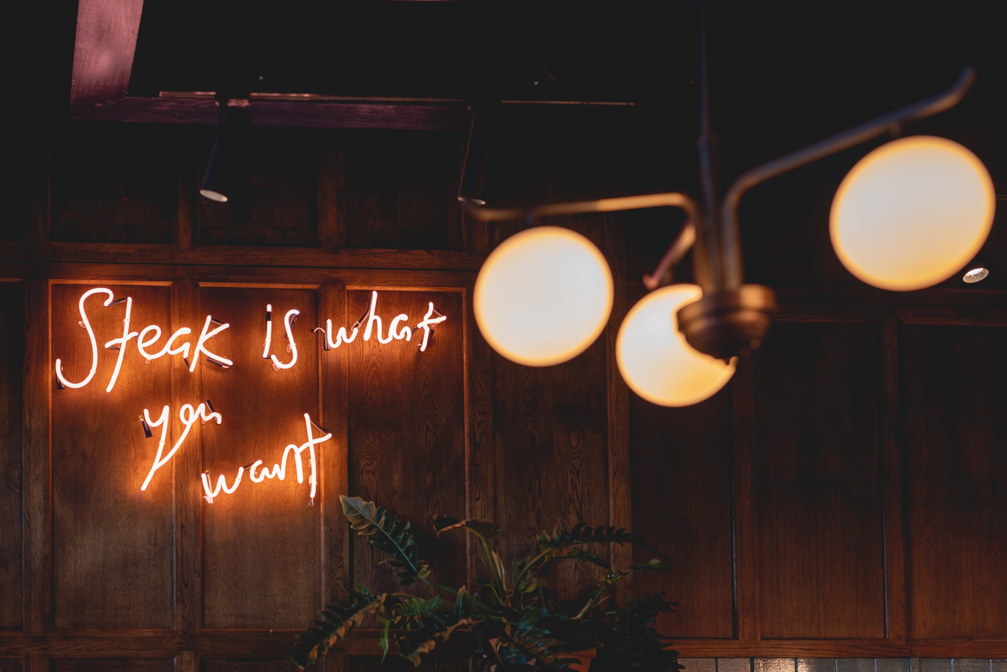 A neon sign in Flat Iron's Stratford restaurant