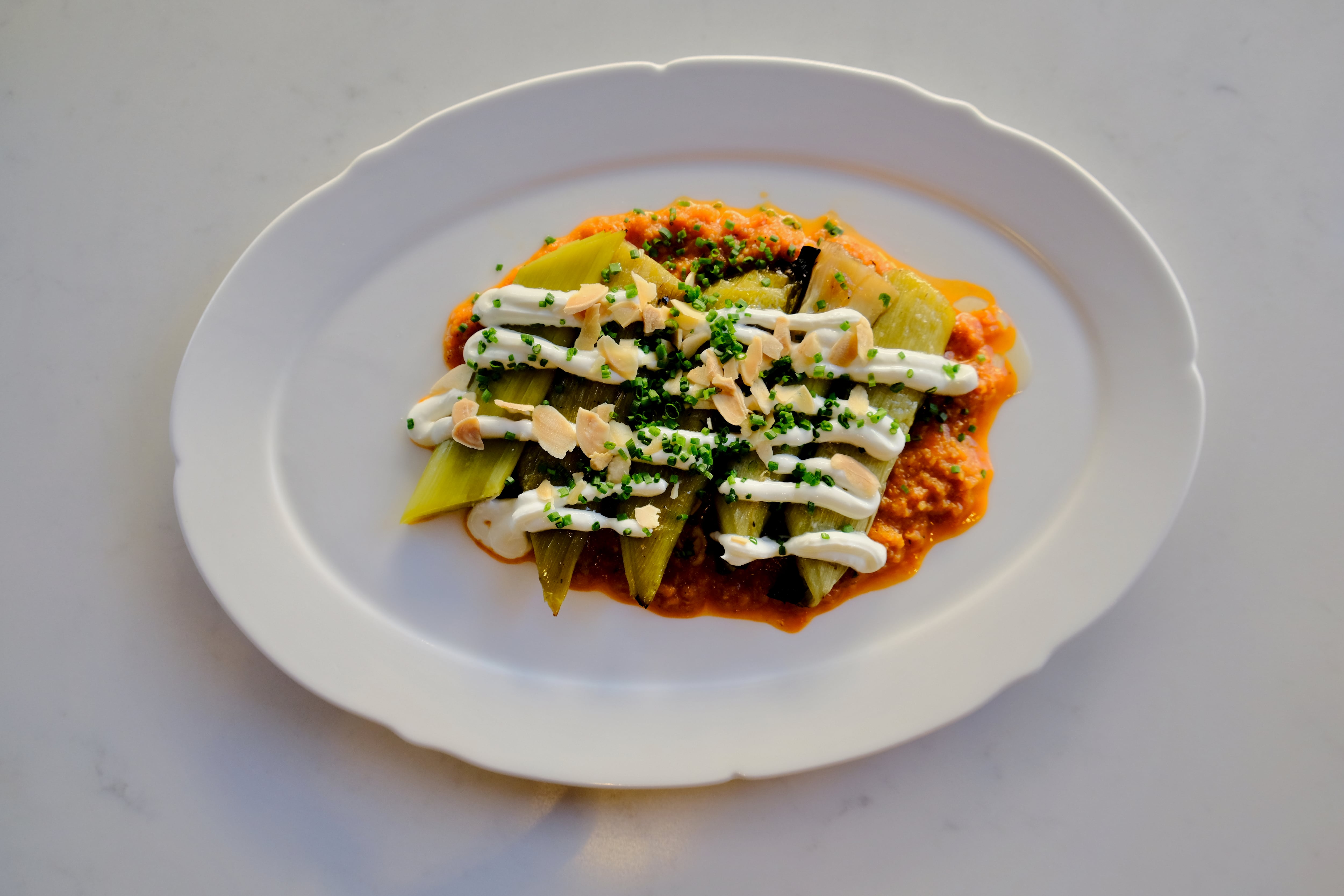 Charred leeks, romesco sauce, almond, yogurt