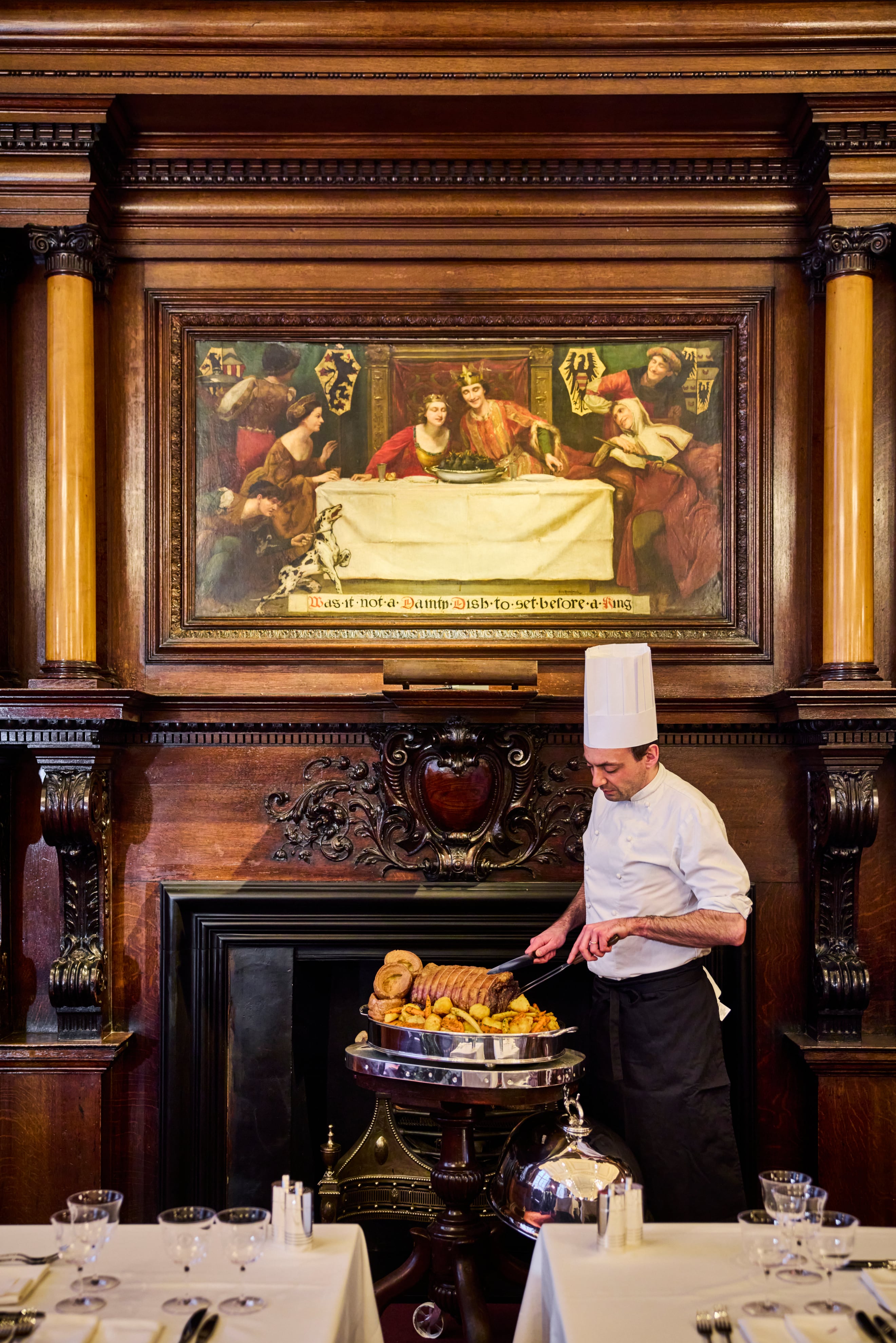 A Master Carver at work at Simpson's in the Strand