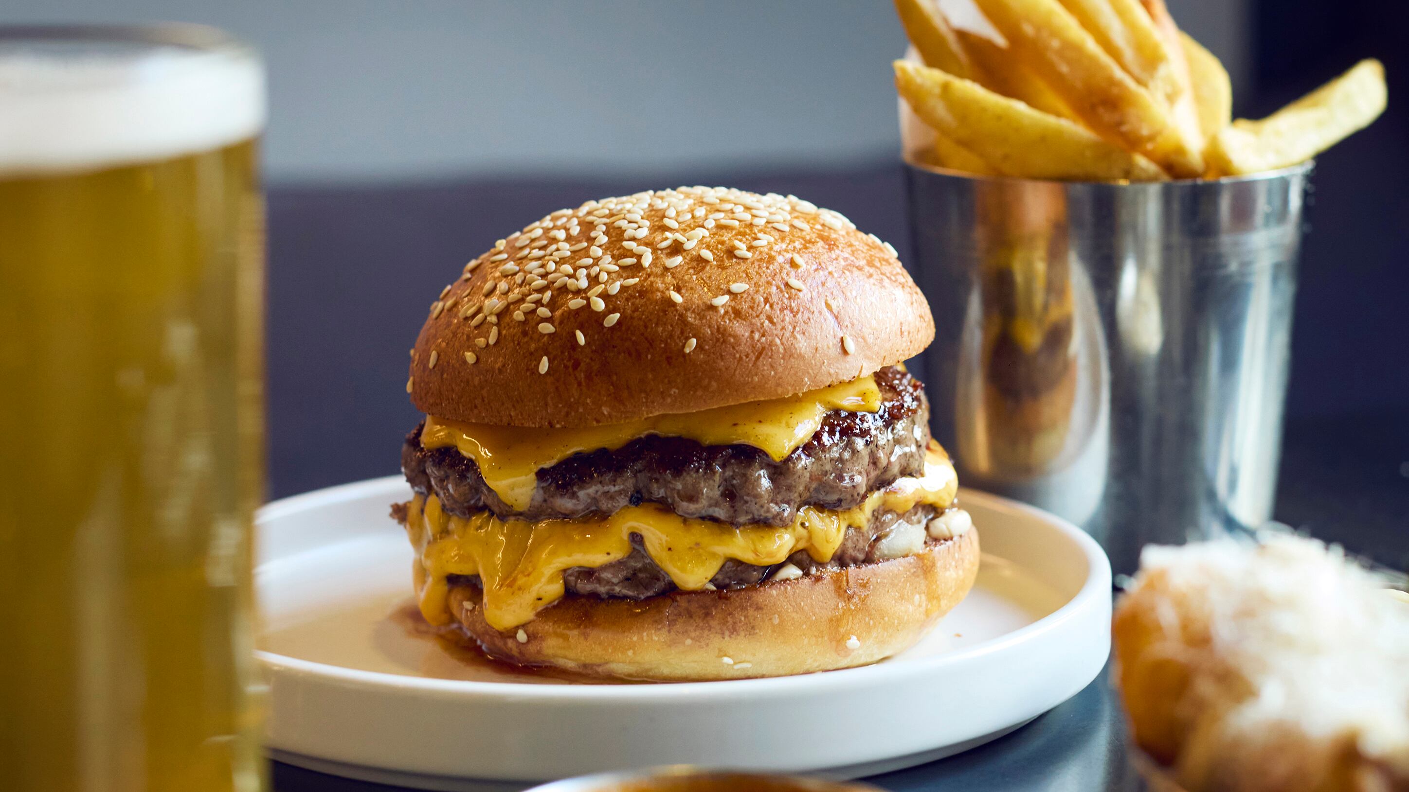 A cheeseburger and chips from Burger and Beyond