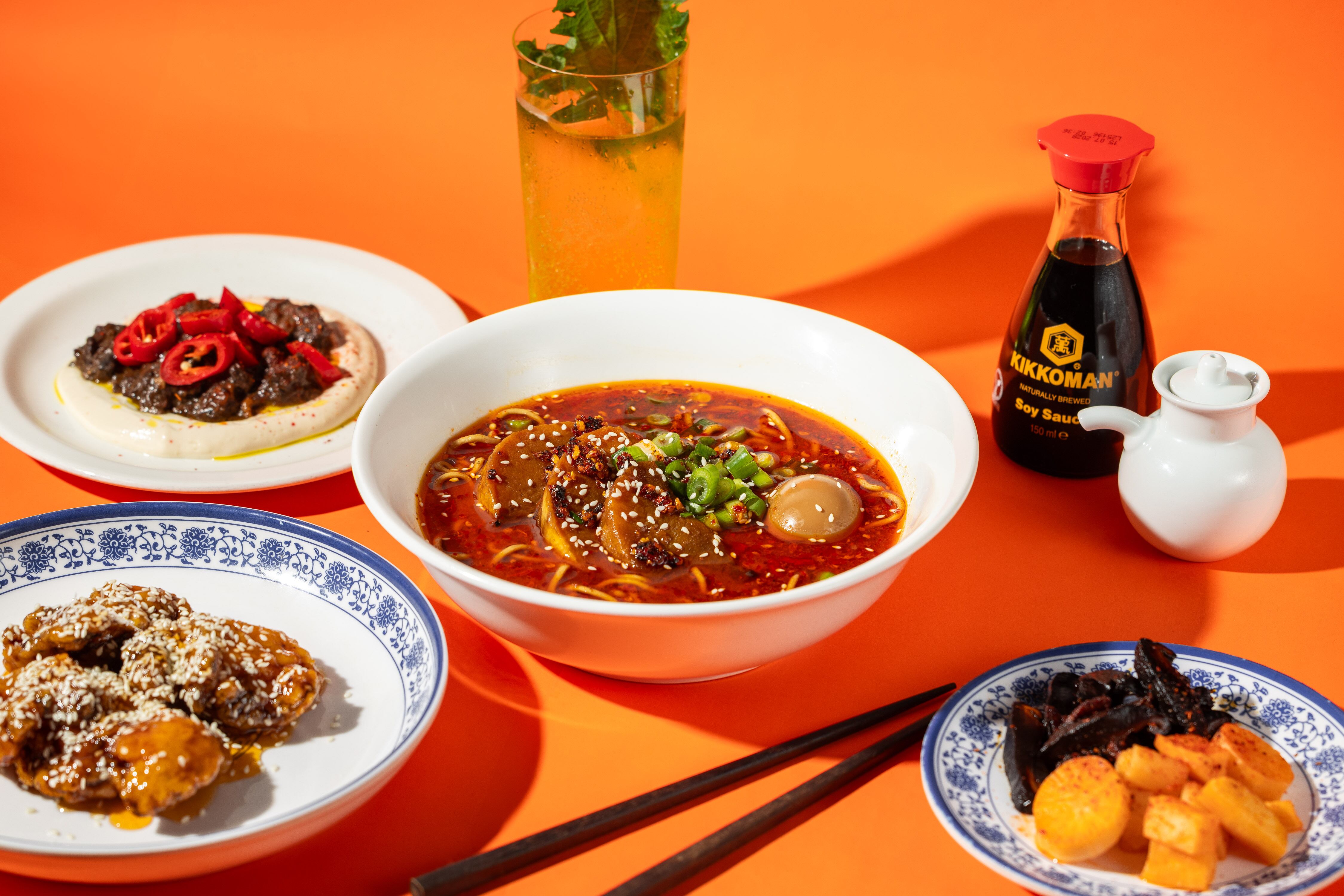 A bowl of ramen and other dishes at Supa Ya