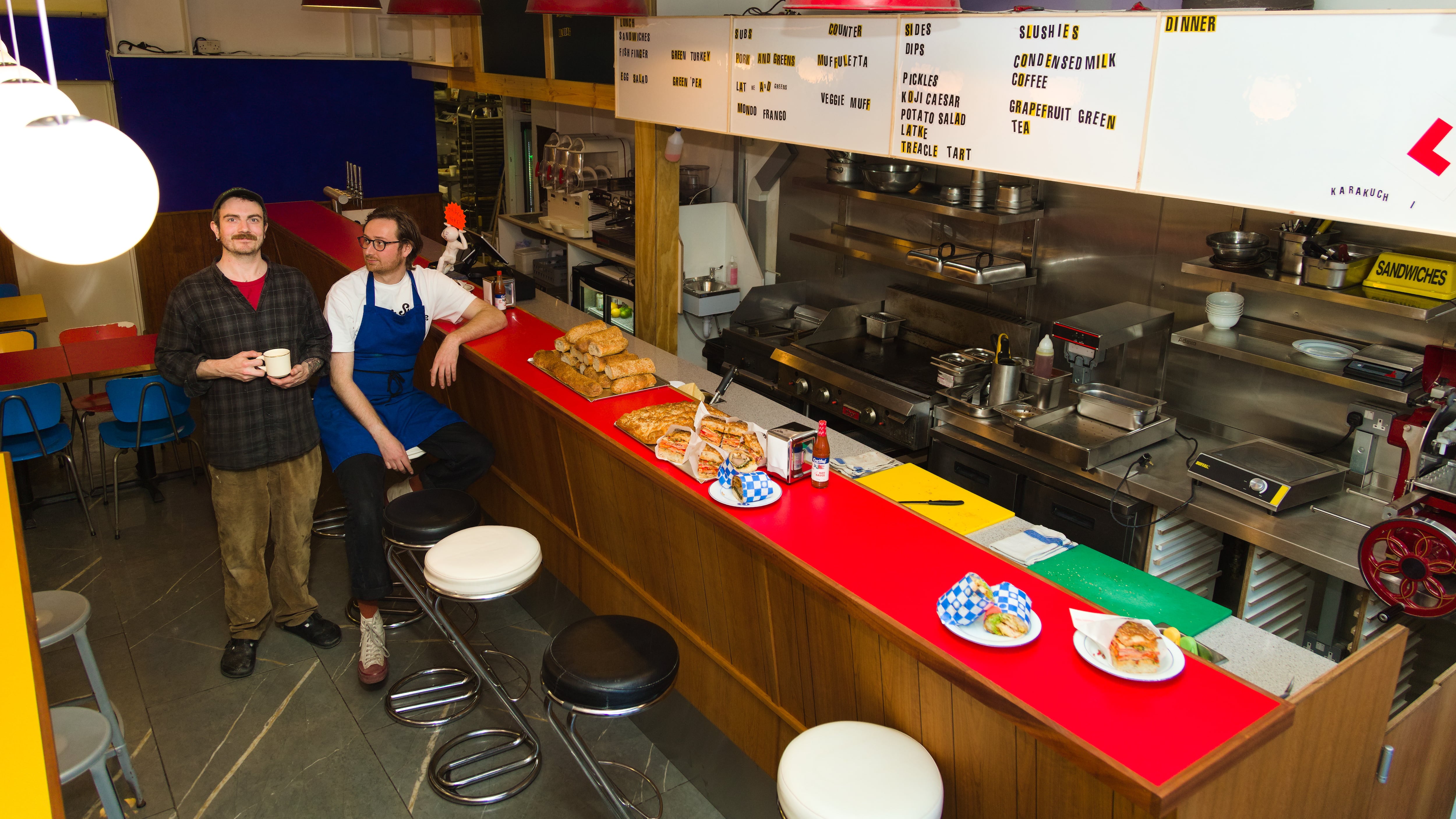 CAFE MONDO is billed as a fast-slinging sandwich joint by day and a dive bar by night