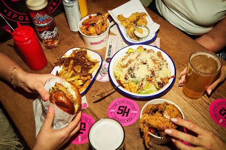 Food on a table being eaten at Side Hustle