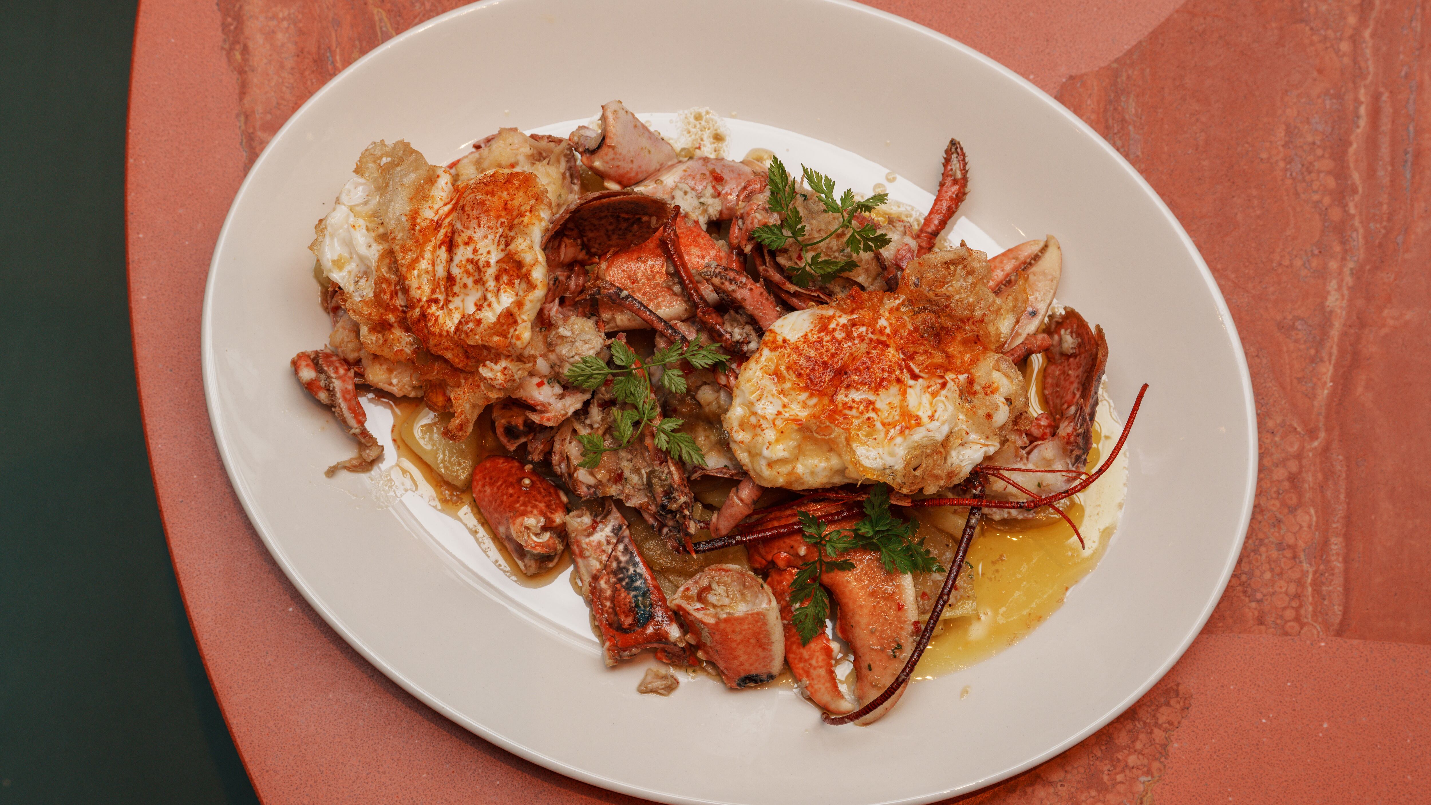 Confit lobster, fried eggs & potatoes at Legado