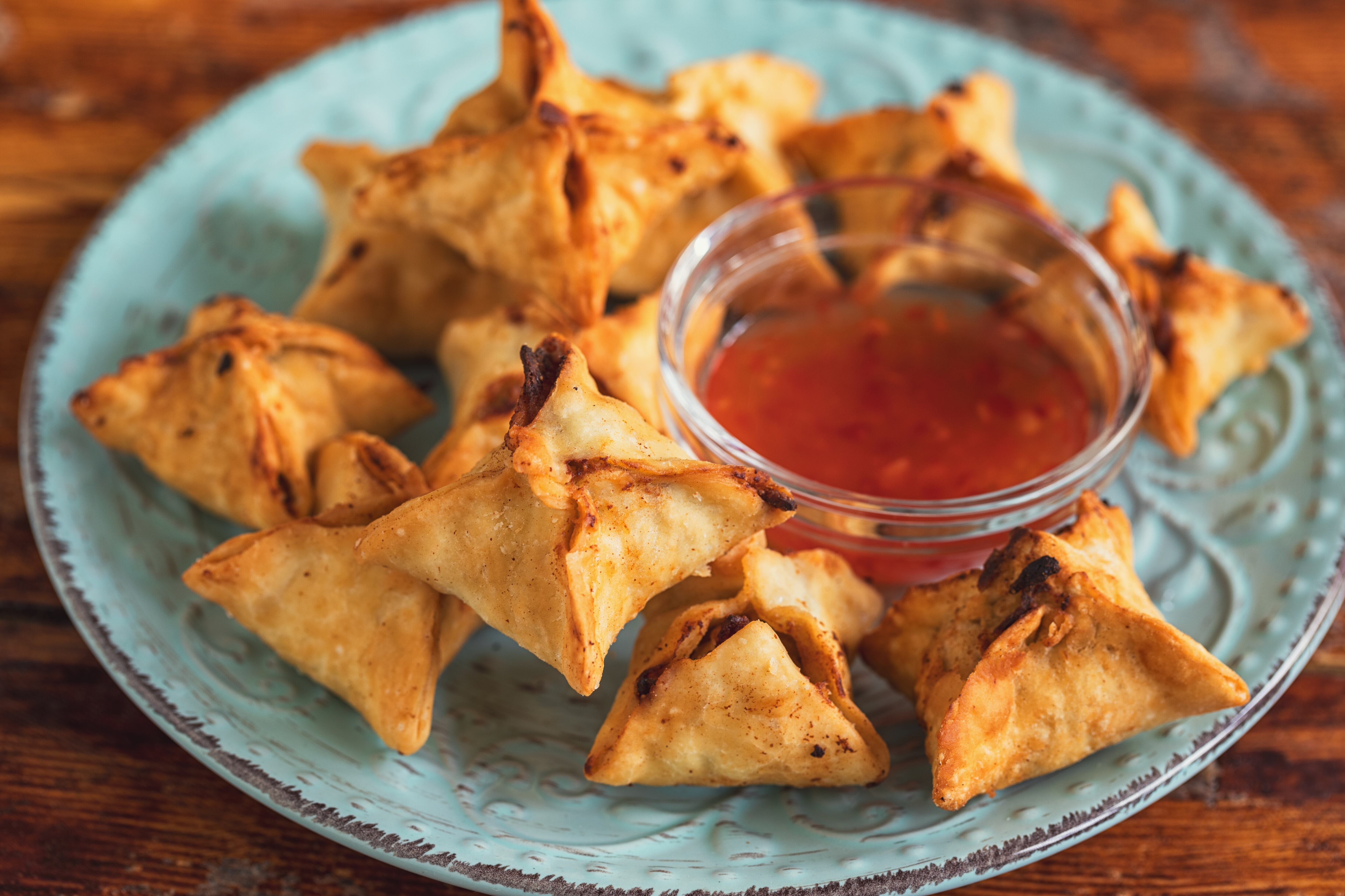 Crispy fried wontons stuffed with a delicious filling made of cream cheese and crab meat
